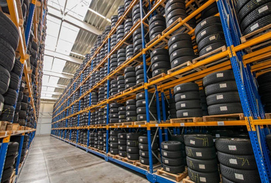 An interior view of a tire warehouse highlights the dense storage conditions and the significant combustible fuel load present in such facilities.