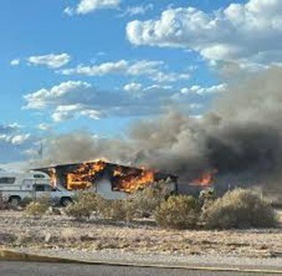 The aftermath of the fire reveals extensive structural damage and the significant loss potential associated with large-scale industrial storage facilities.
