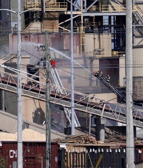 Firefighters deploy elevated master streams