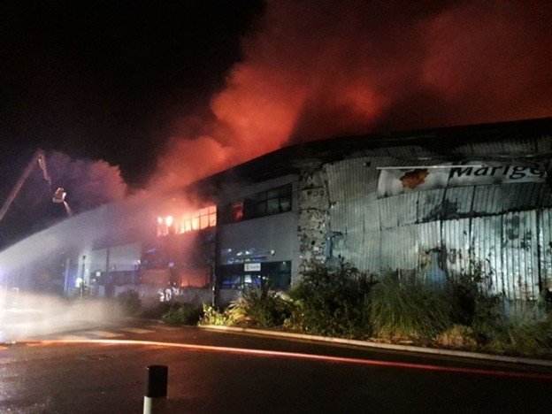 Jaguar and Land Rover Service Center fire damages adjoining building.