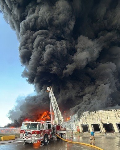 firetruck in front of huge blaze
