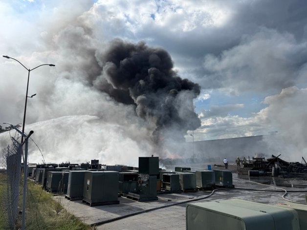 Heavy black smoke rising into the air from a fire at the Howard Industries transformer plant in Laurel Mississippi