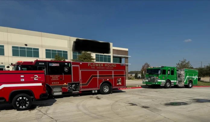 Flower Mound and Denton firefighters responding to a titanium powder fire at an industrial facility.