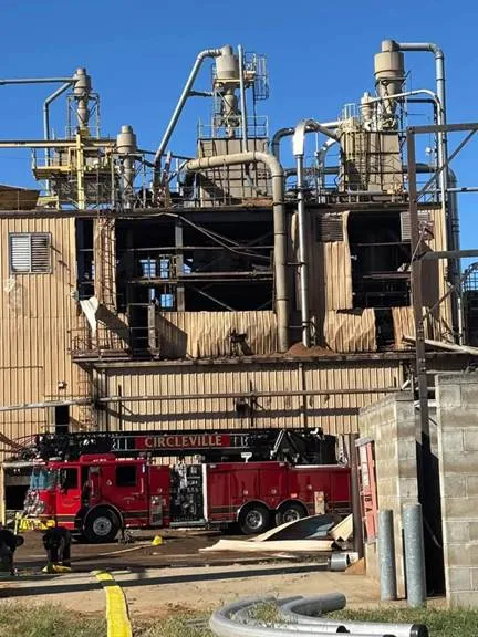 Firefighters responding to a machinery explosion at a Circleville wood-processing facility